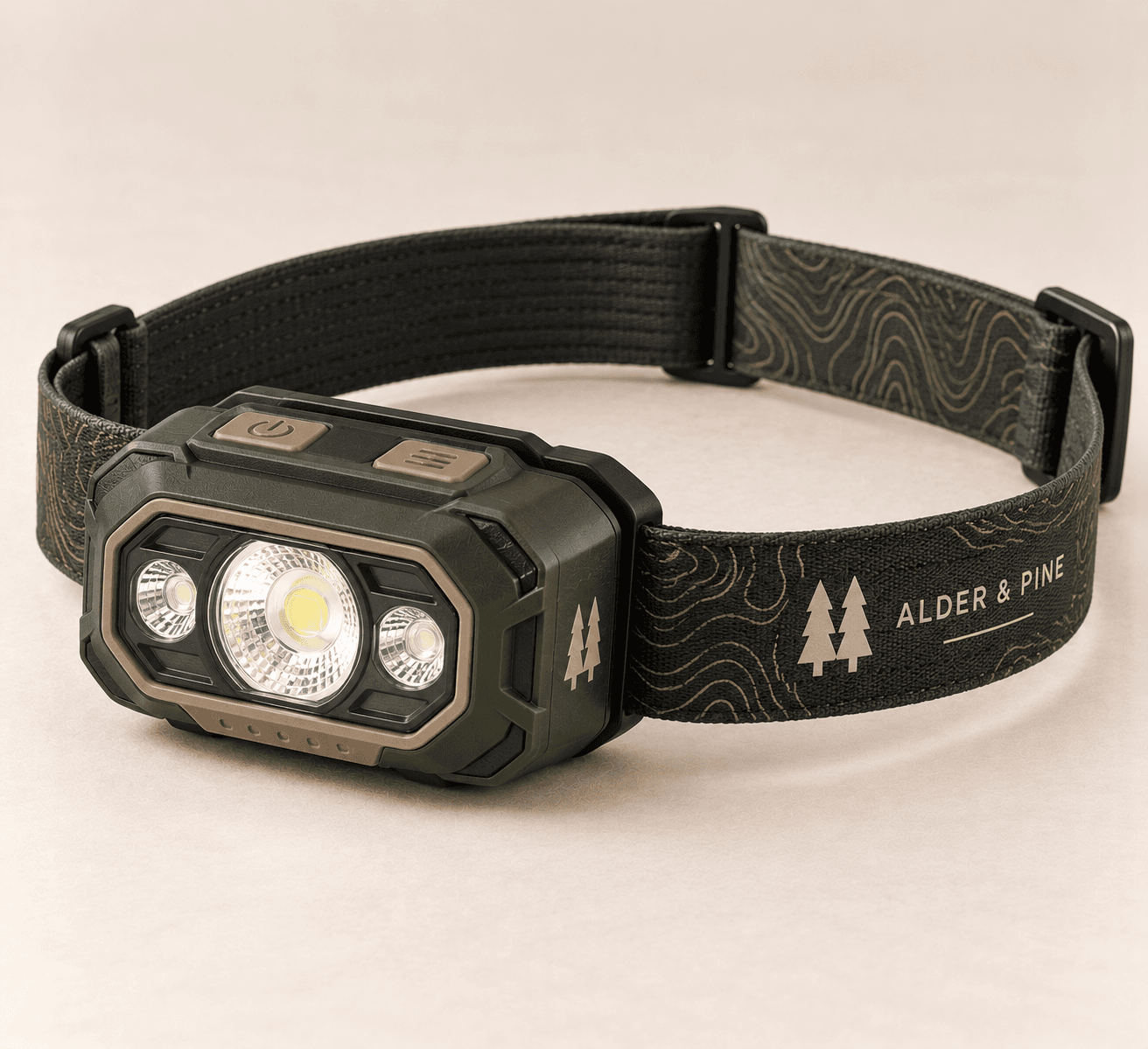 Finley 350 Headlamp in forest green and black with a topographic headband and a triple-LED lens