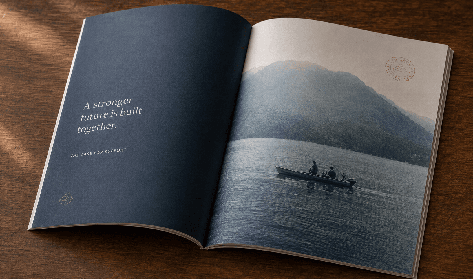 Fictional Solid Ground annual impact report open to a spread of a lake at dawn.